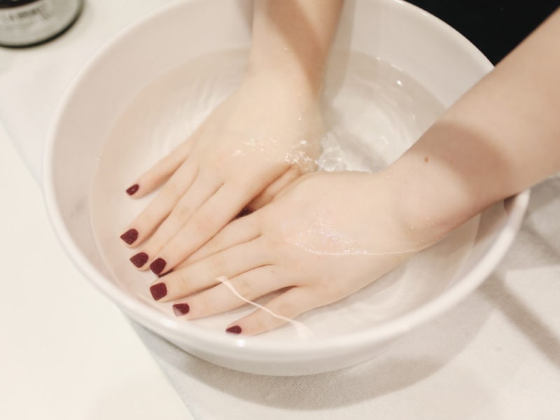 photo-of-person-s-hand-soak-in-water-3738378